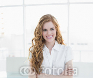 Portrait_of_an_elegant_businesswoman_in_office.jpg